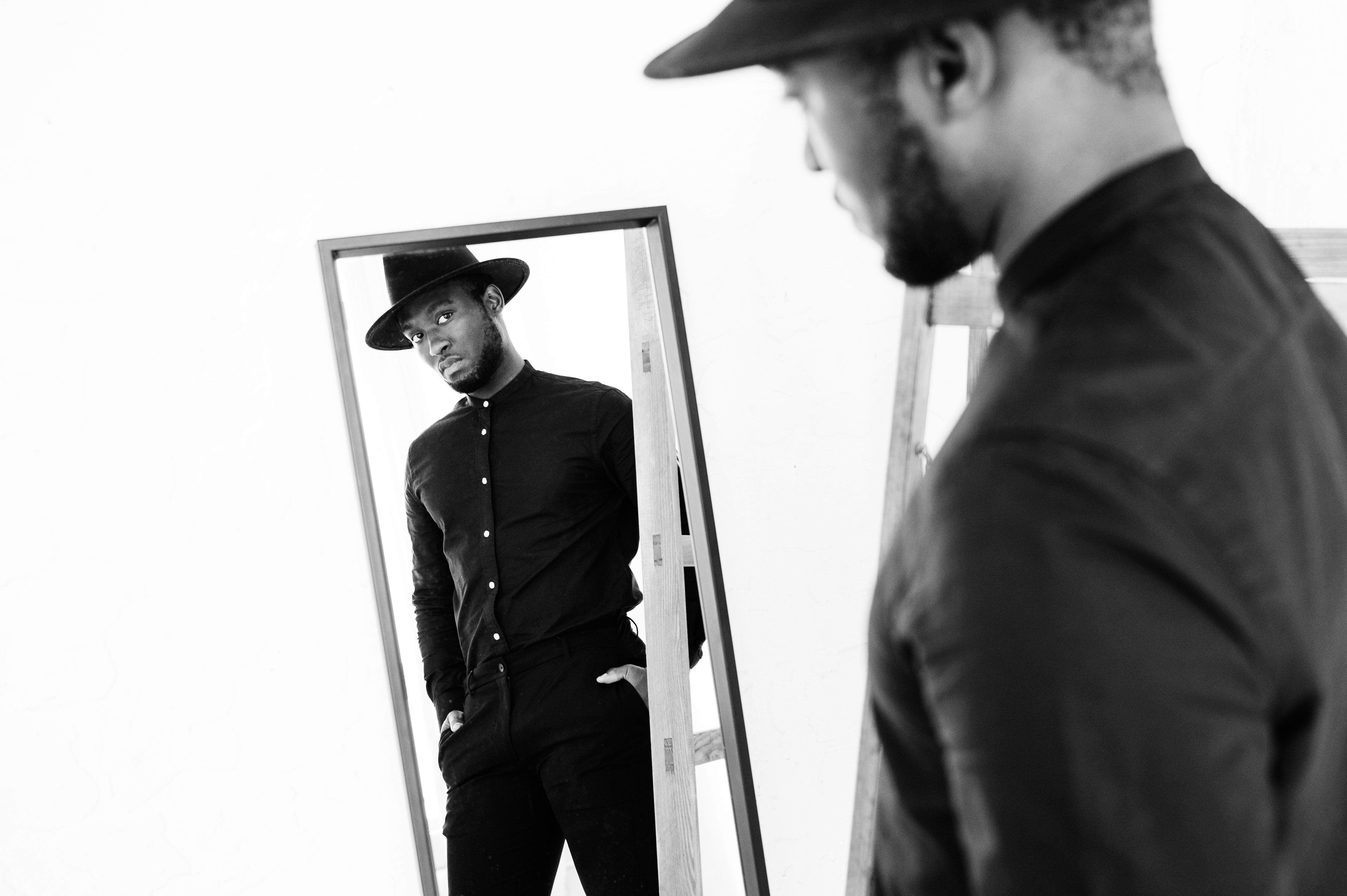 black man looking in the mirror